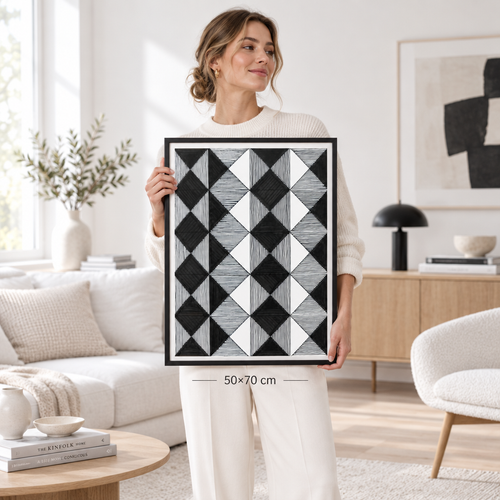 Woman holding 50x70 cm diamond grid Op-Art print in minimalist white Scandinavian interior