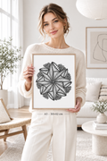Woman holding A3 mandala bloom zentangle print in minimalist white Scandinavian interior