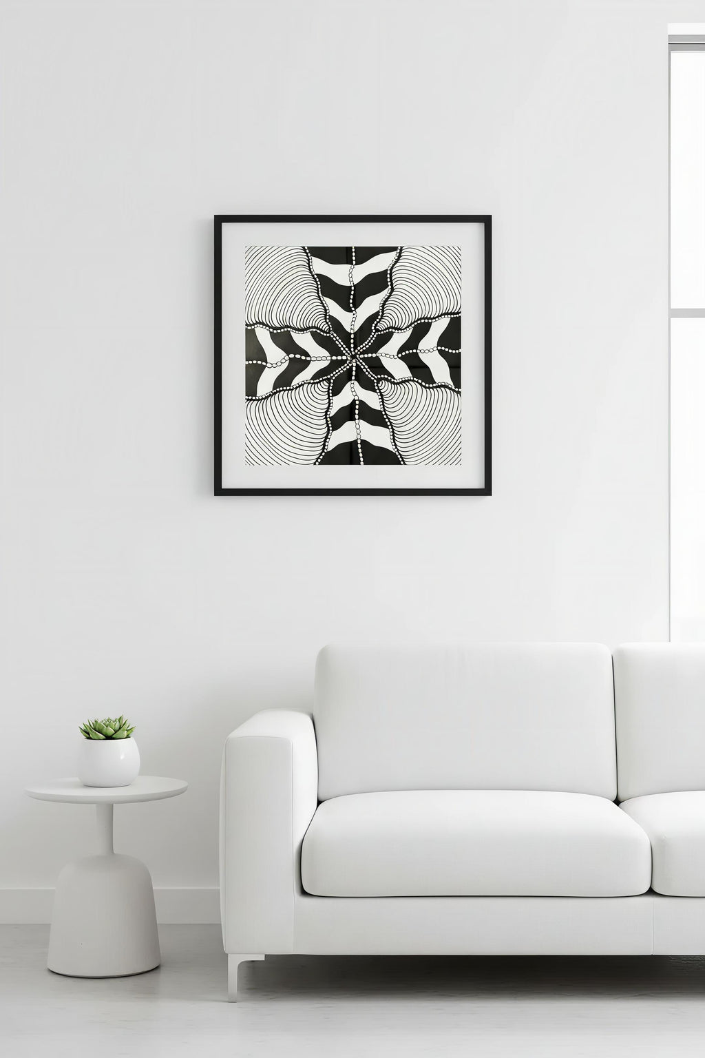 Wave zentangle mandala art print in black frame on white wall above white sofa, minimalist living room wall decor